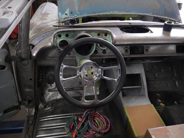 Bare-metal dash with steering wheel and wiring