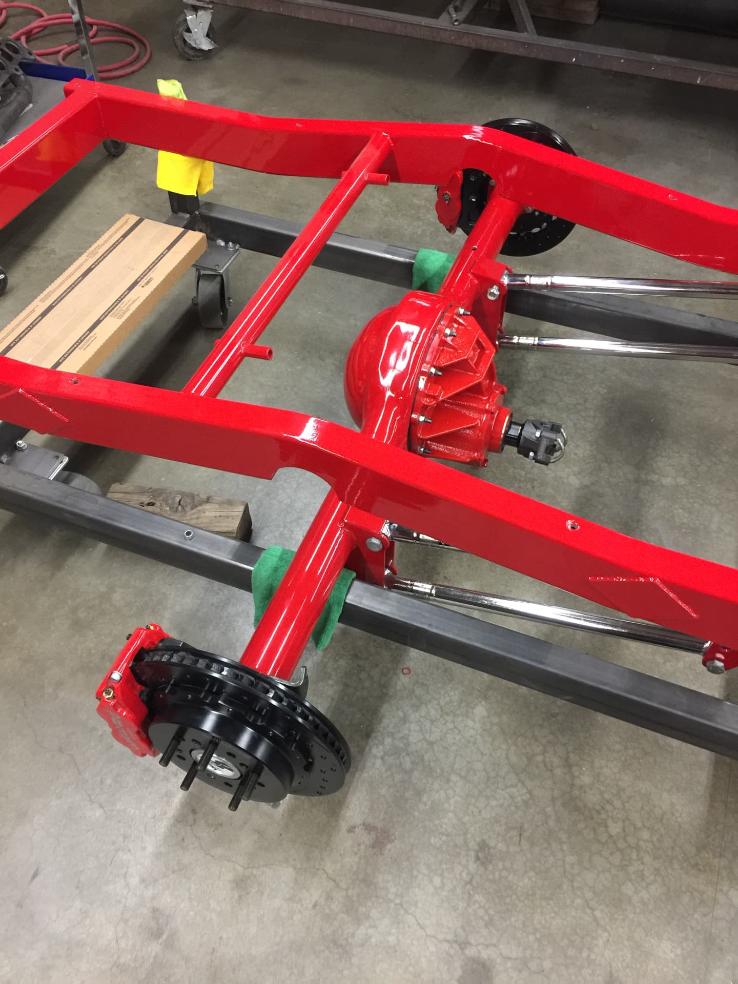 Red chassis with custom suspension and drivetrain