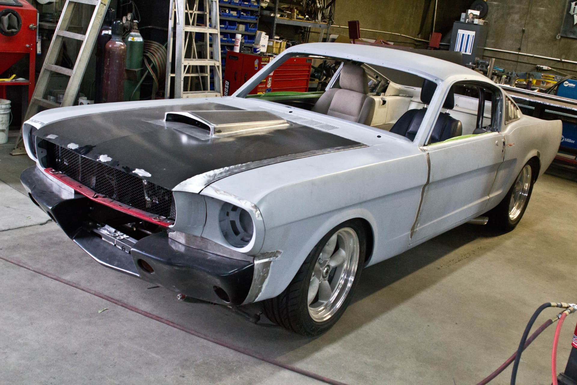 Bodywork in primer with custom hood scoop