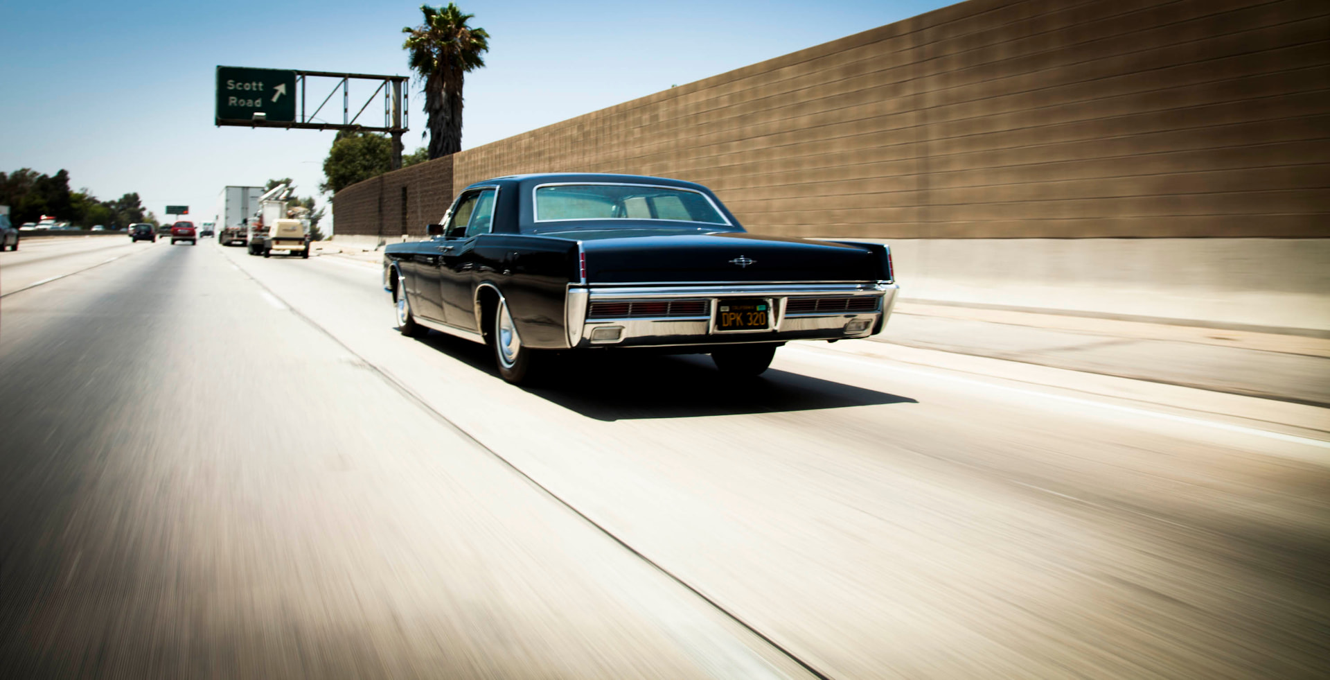 Tail-end panning shot — slab-sided elegance in motion