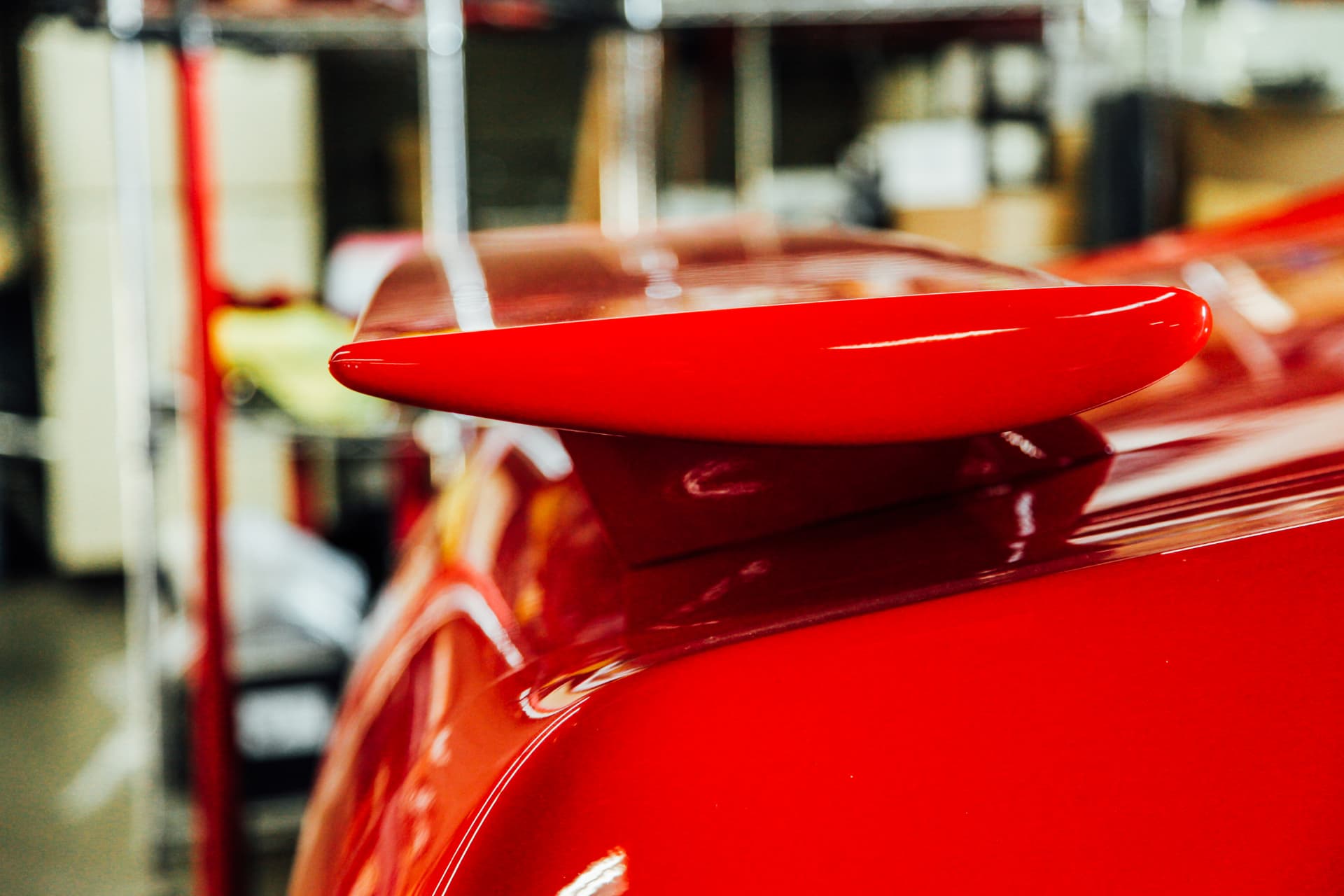 Spoiler pedestal detail in fresh Cardinal Red