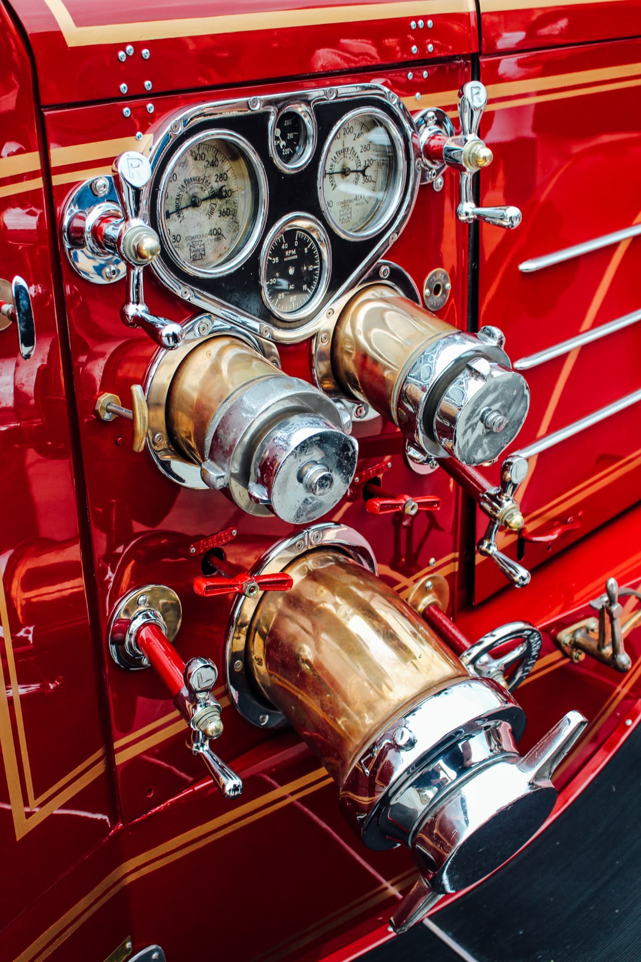 Restored pump panel — original gauges, brass inlets and chrome valve handles