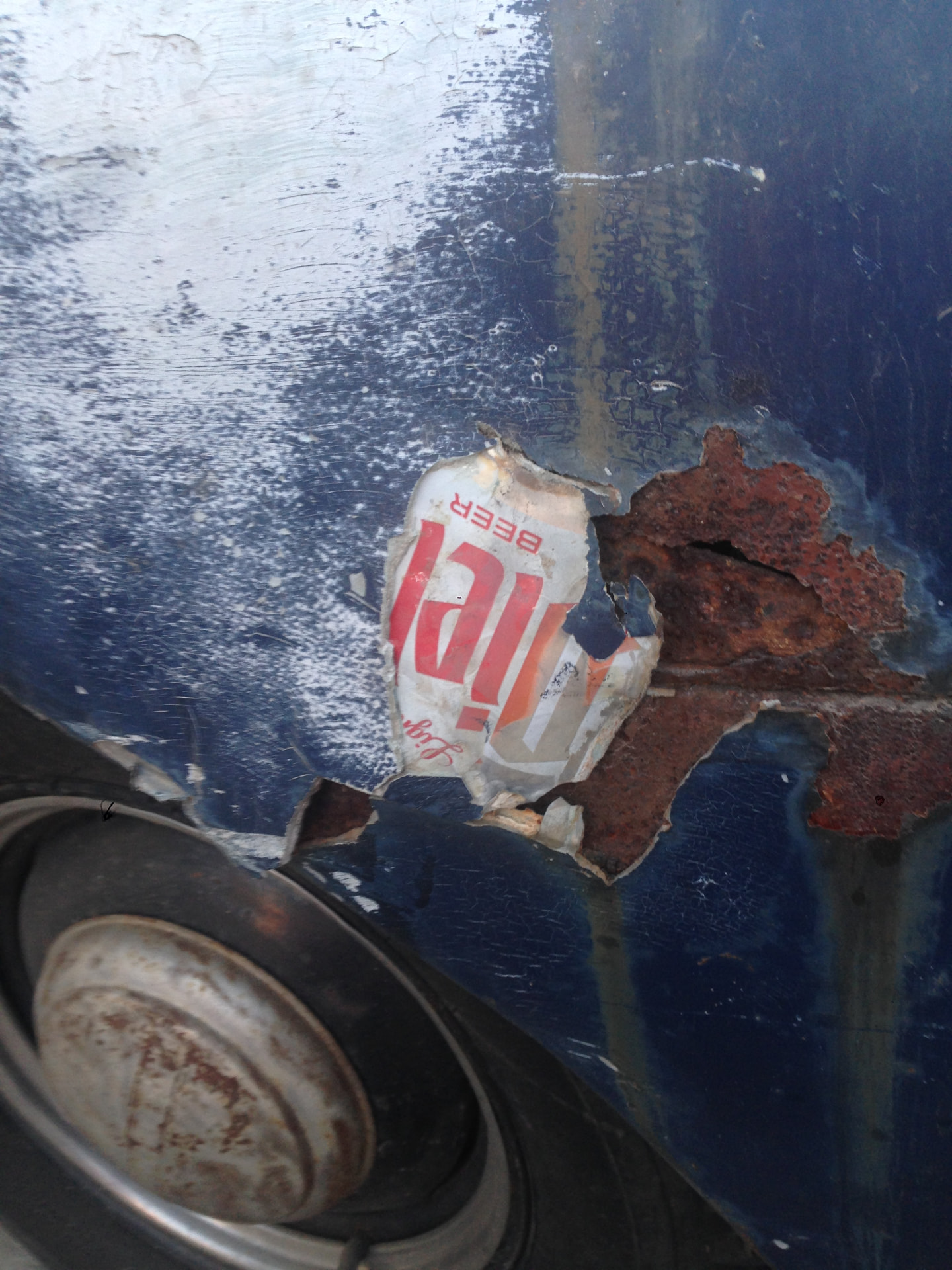 Original rust damage exposed during restoration