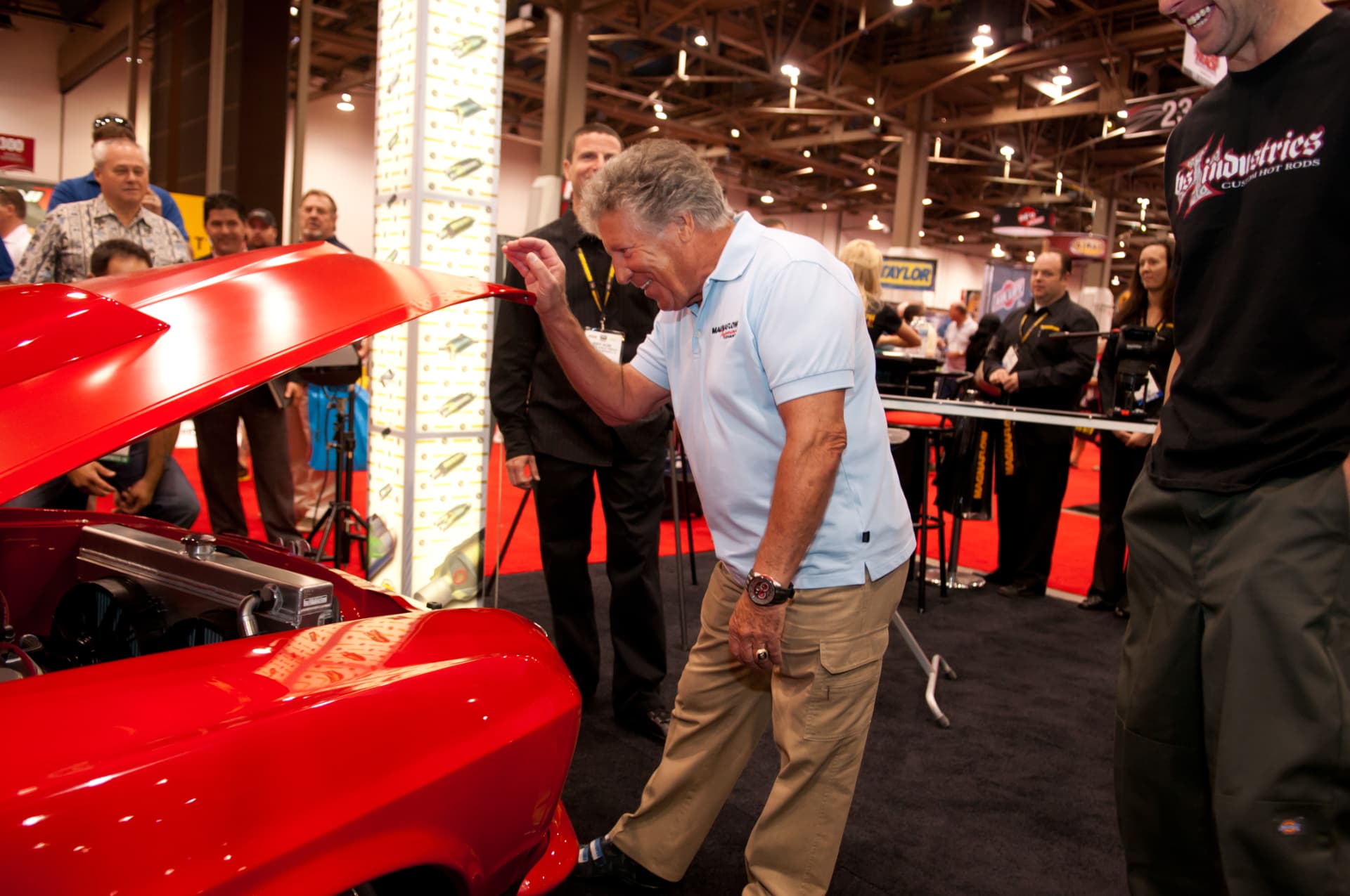 Mario Andretti checking out the car at SEMA
