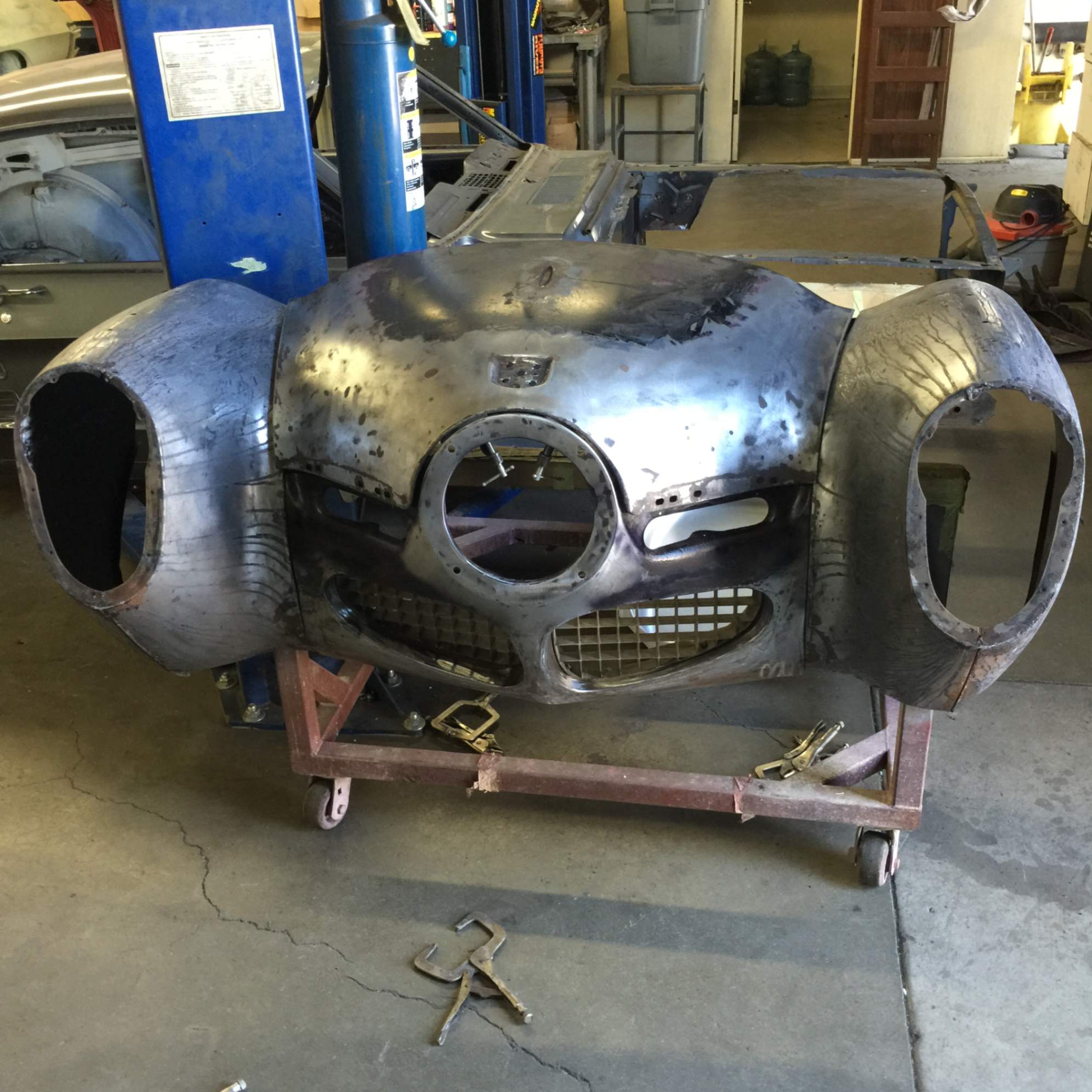 Bare-metal Studebaker nose during metalwork