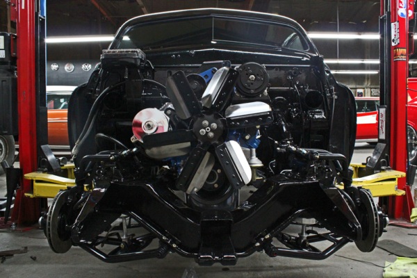 Front view of the completed chassis and drivetrain on the lift
