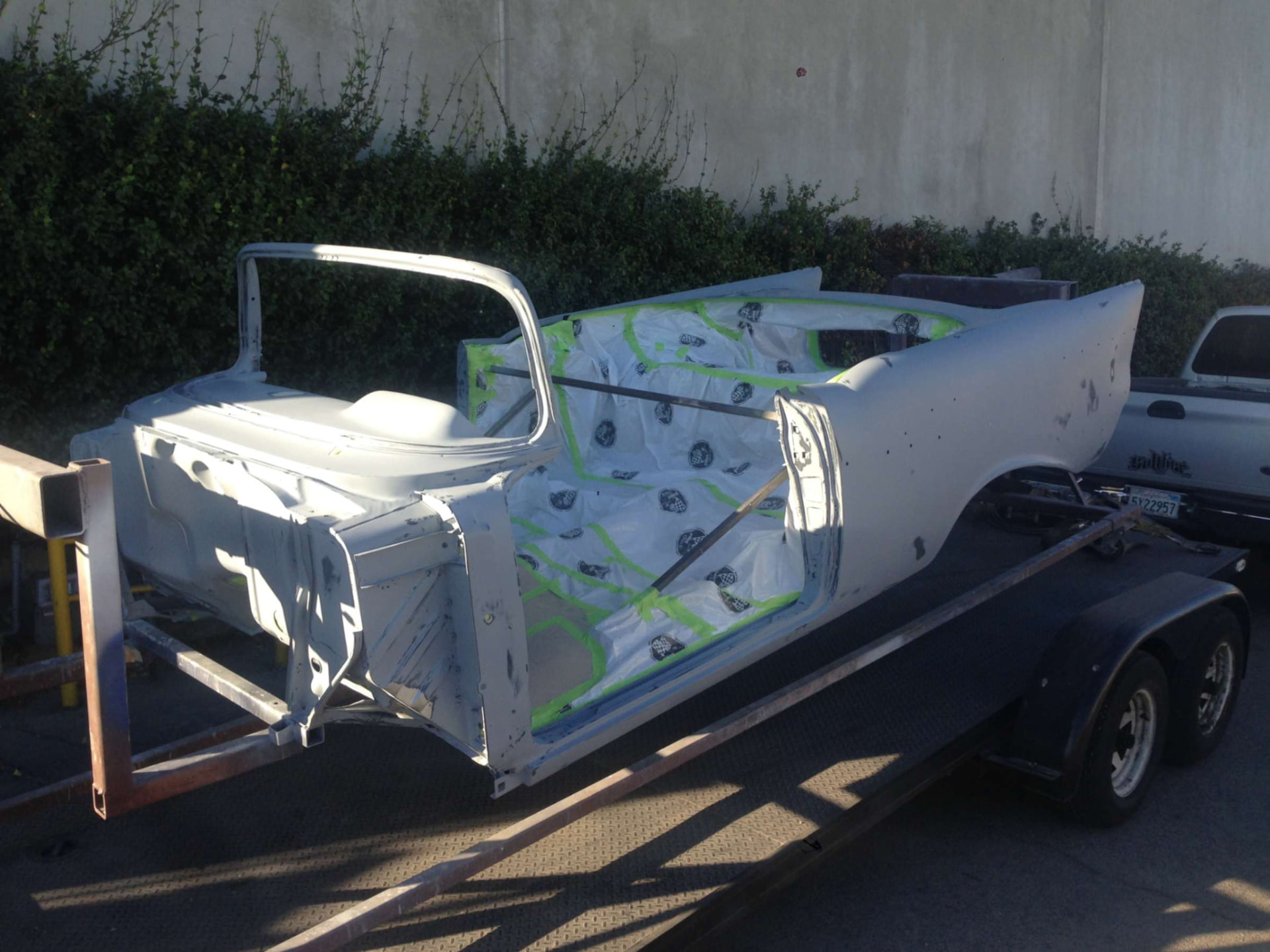 Body shell in primer on the trailer