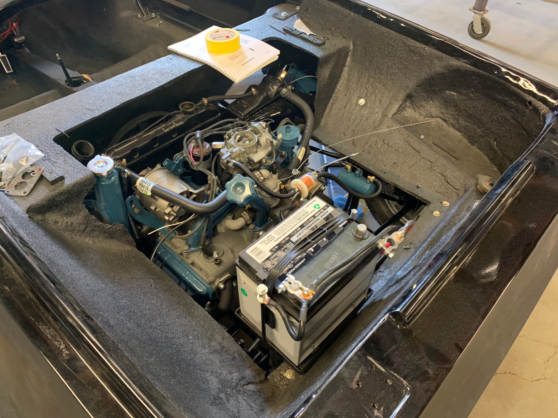 Engine, cooling system, and battery installation