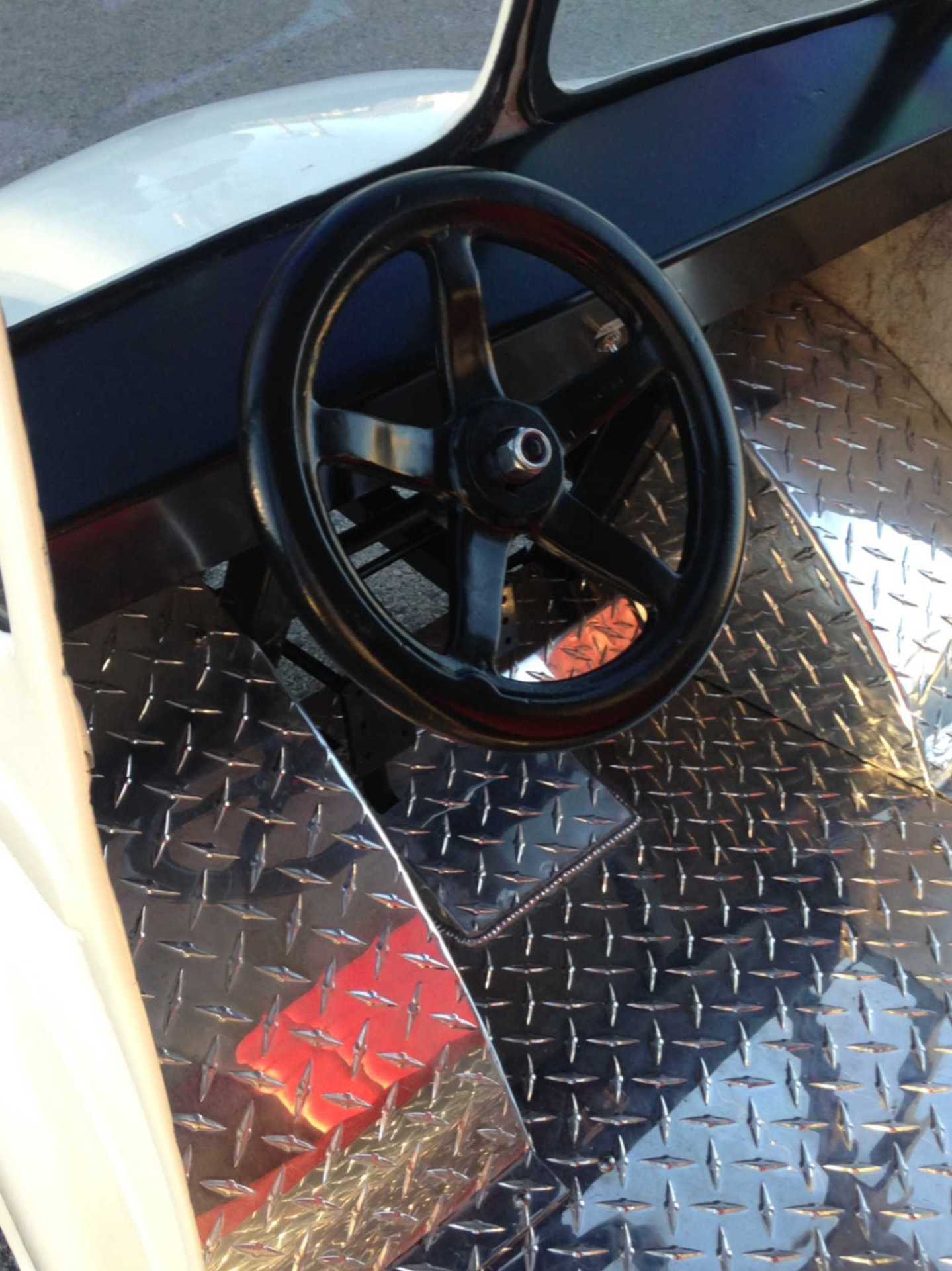 Steering wheel and polished diamond-plate floor