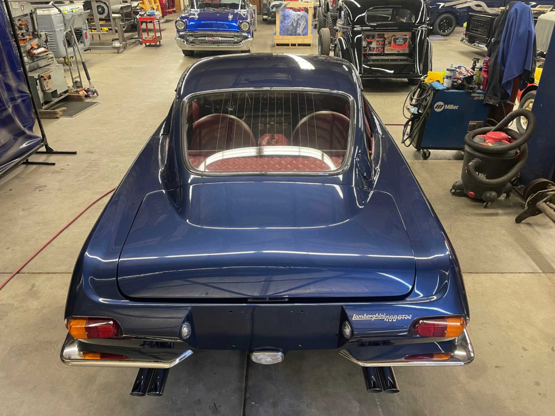 Finished rear view with quad exhaust tips in the shop