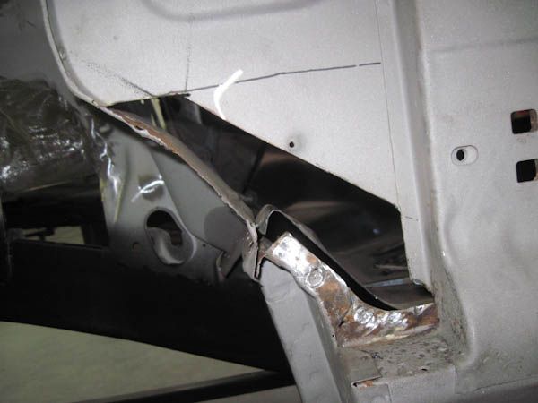 Rusted body section cut away for metal repair