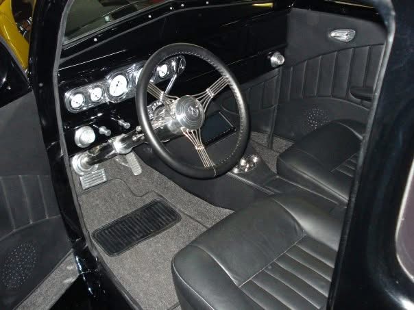 Finished custom black interior, dashboard, and steering wheel