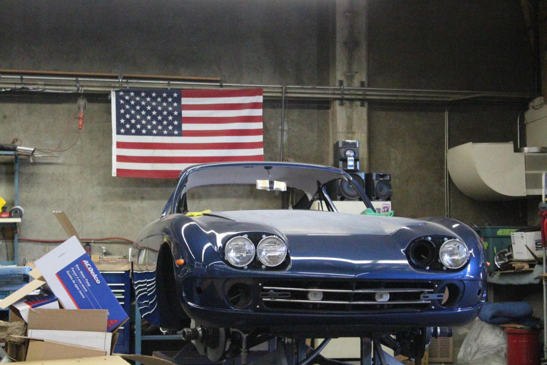 Painted body on the lift during reassembly