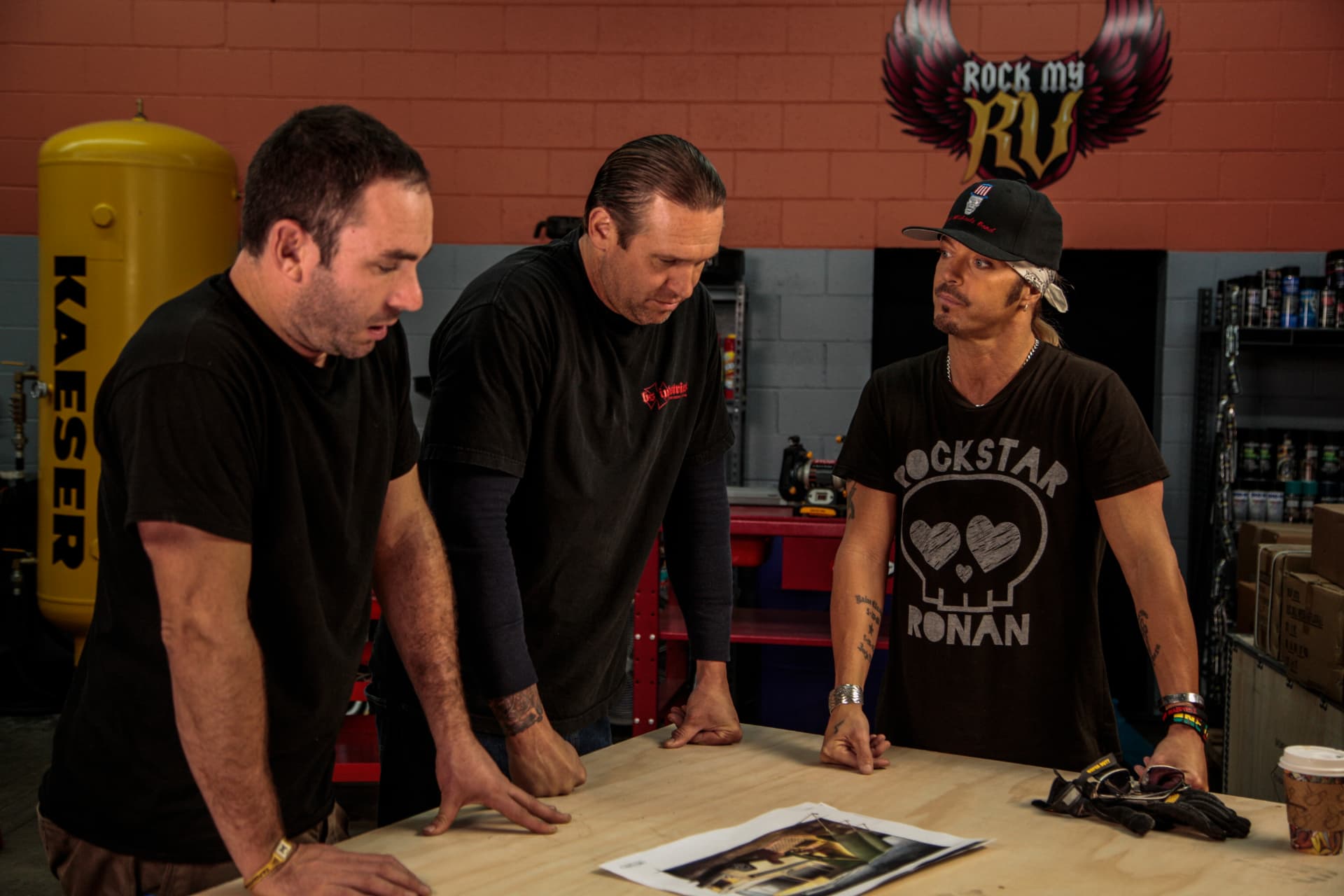 Bodie, Bret, and the design team around the build table