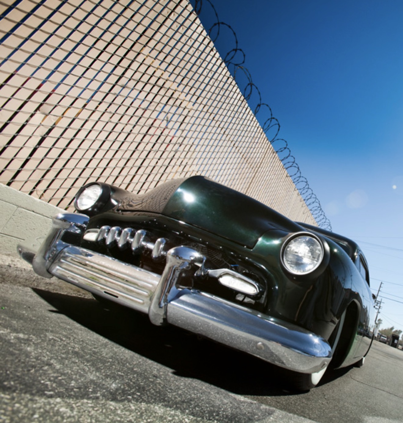 Low front end view — drooped beams and custom grille teeth