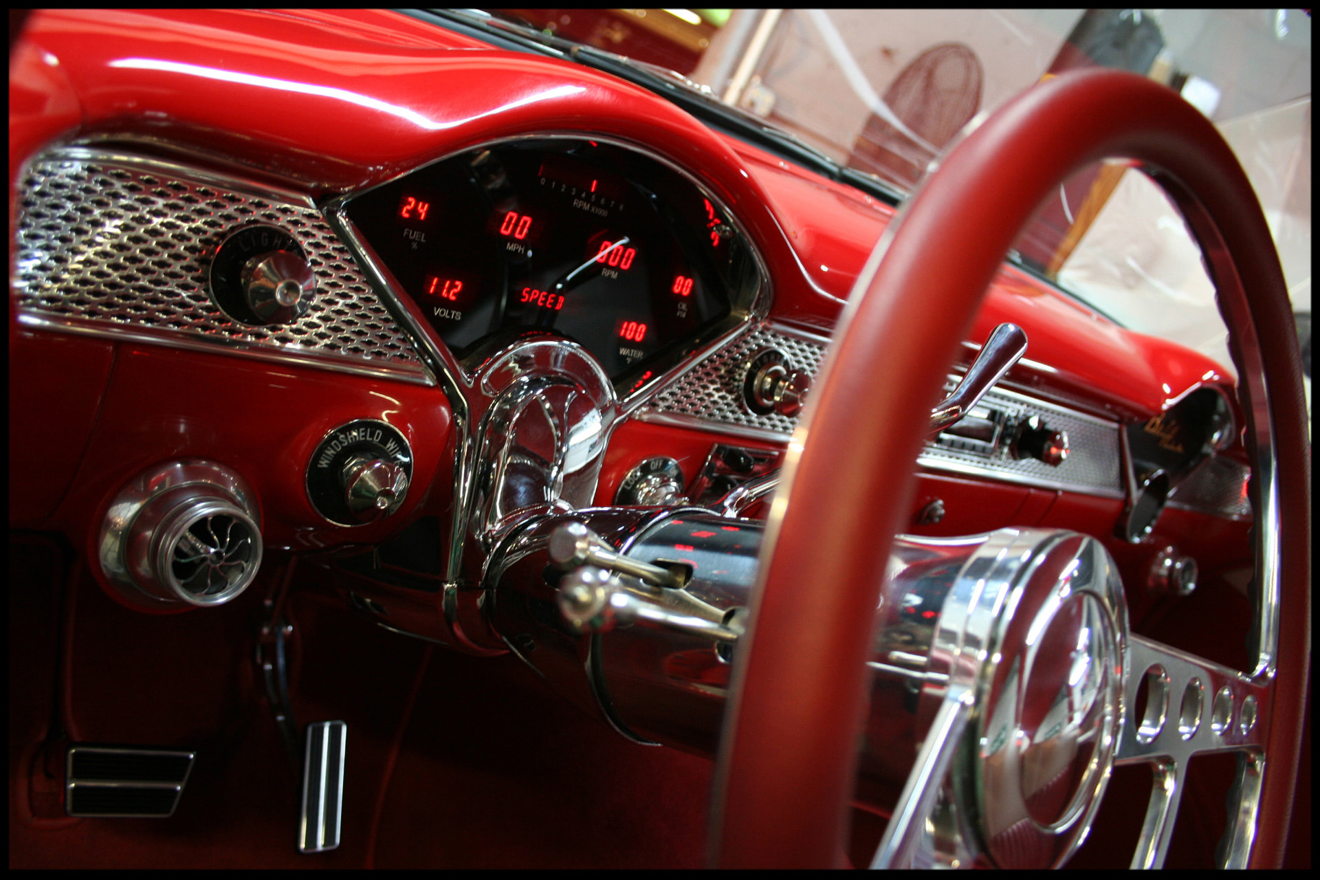 Digital dash behind the stock-style wheel
