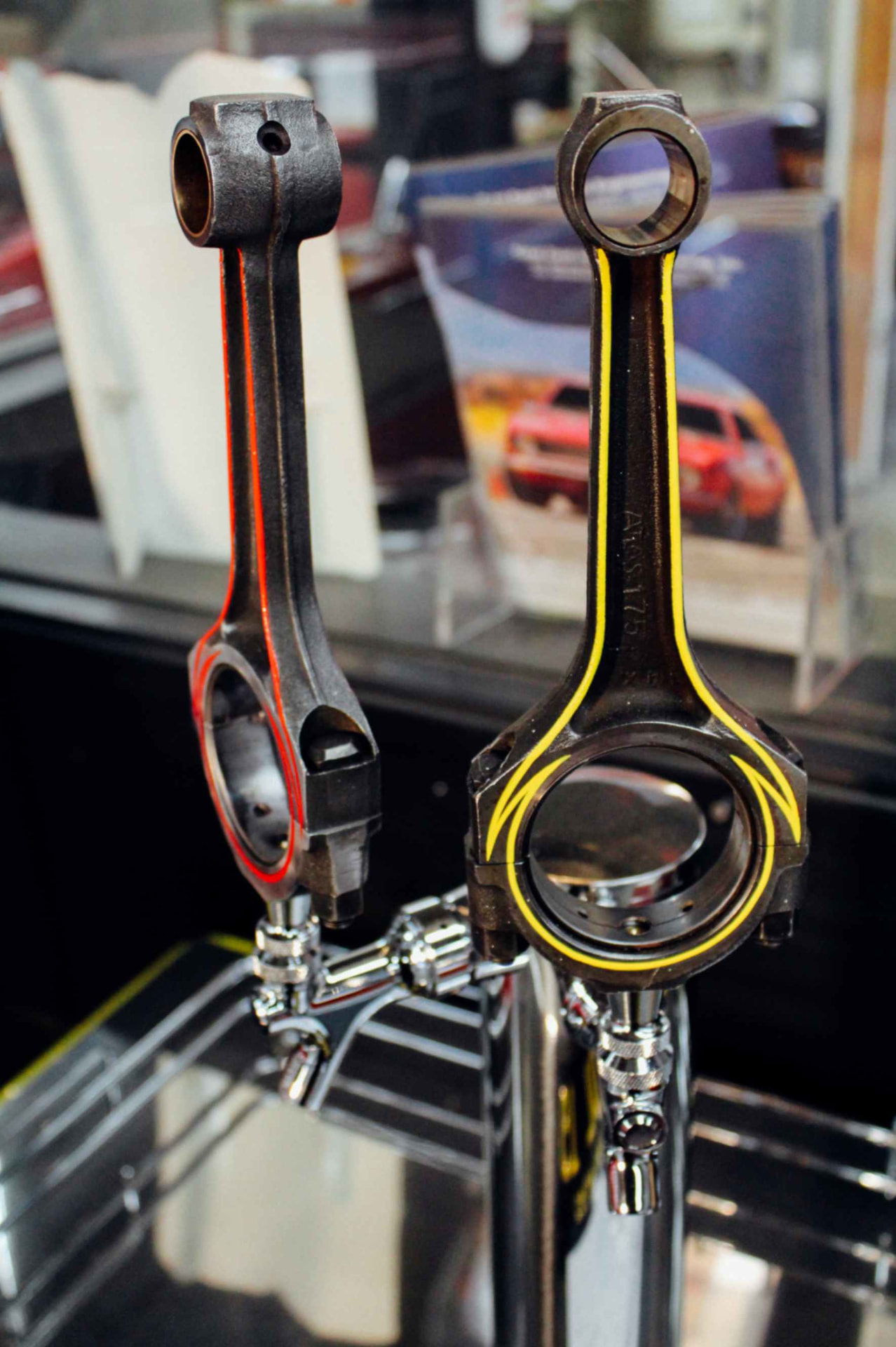Custom tap handles made from engine connecting rods, pinstriped red and yellow