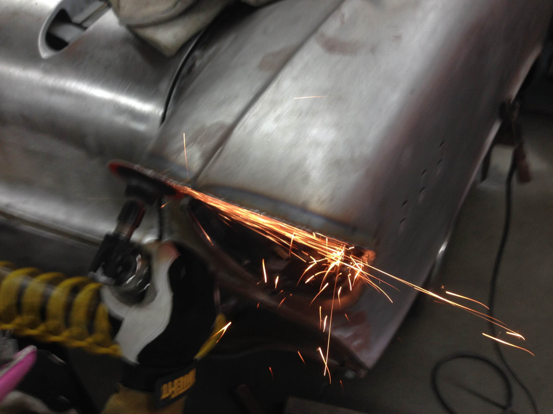 Grinding metalwork on the body