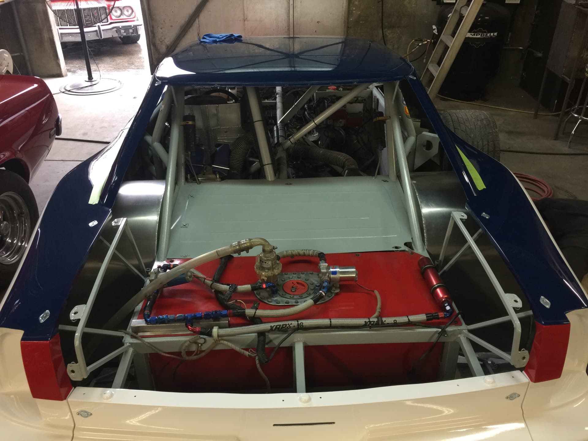 Fuel system and rear chassis assembly