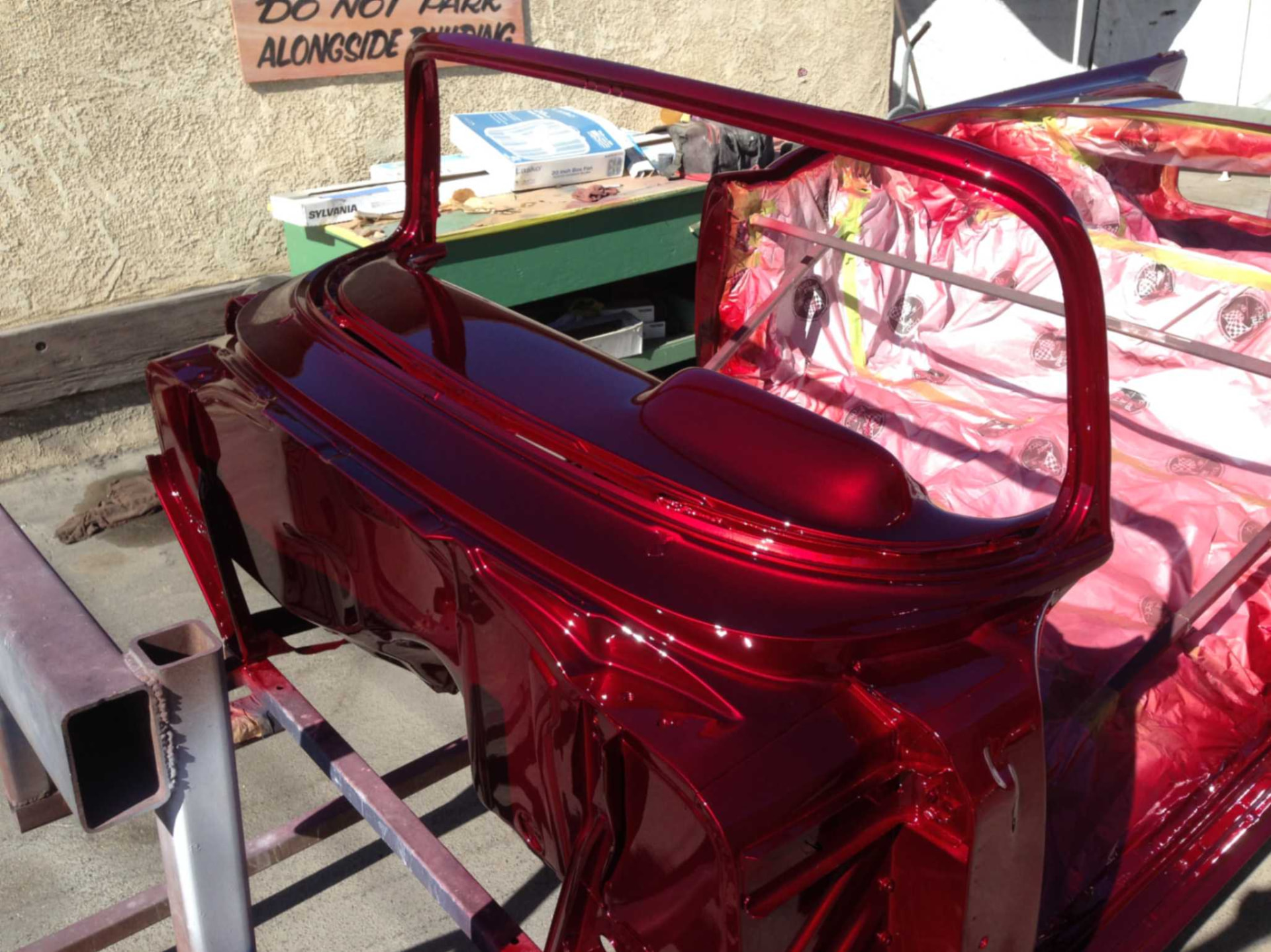 Fresh candy-red paint on the windshield frame and cockpit