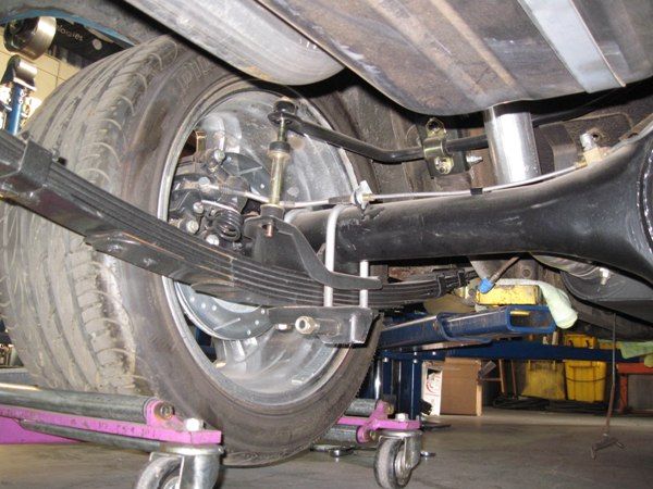 Rear axle, suspension, and brake assembly during the build