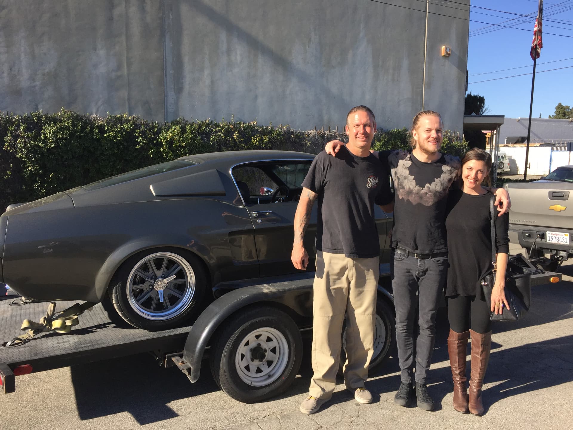 Dan Reynolds, Bodie and Aja with the 1967 Mustang on delivery day