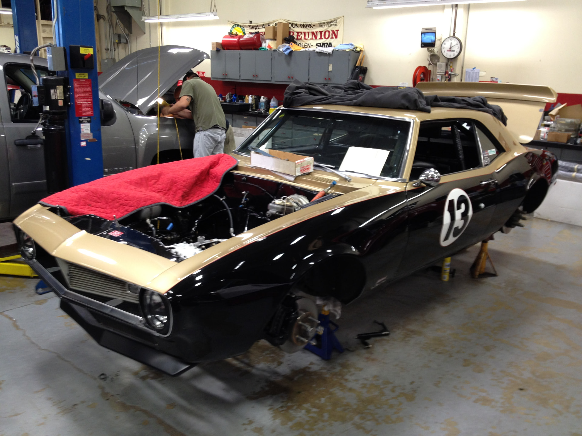 The black-and-gold Yunick tribute Camaro in the shop