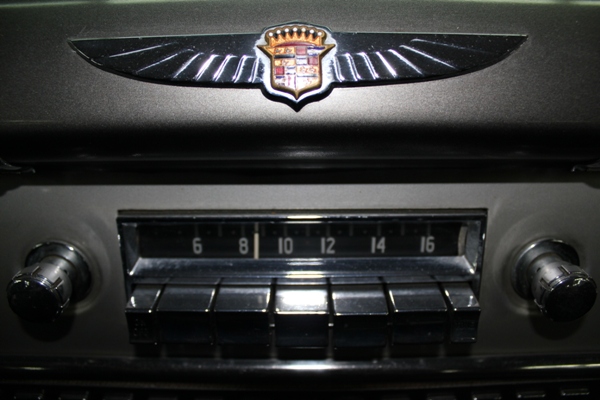 Restored Cadillac radio and crest detail