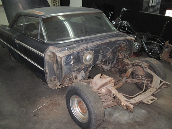 Teardown begins — front clip and suspension removed