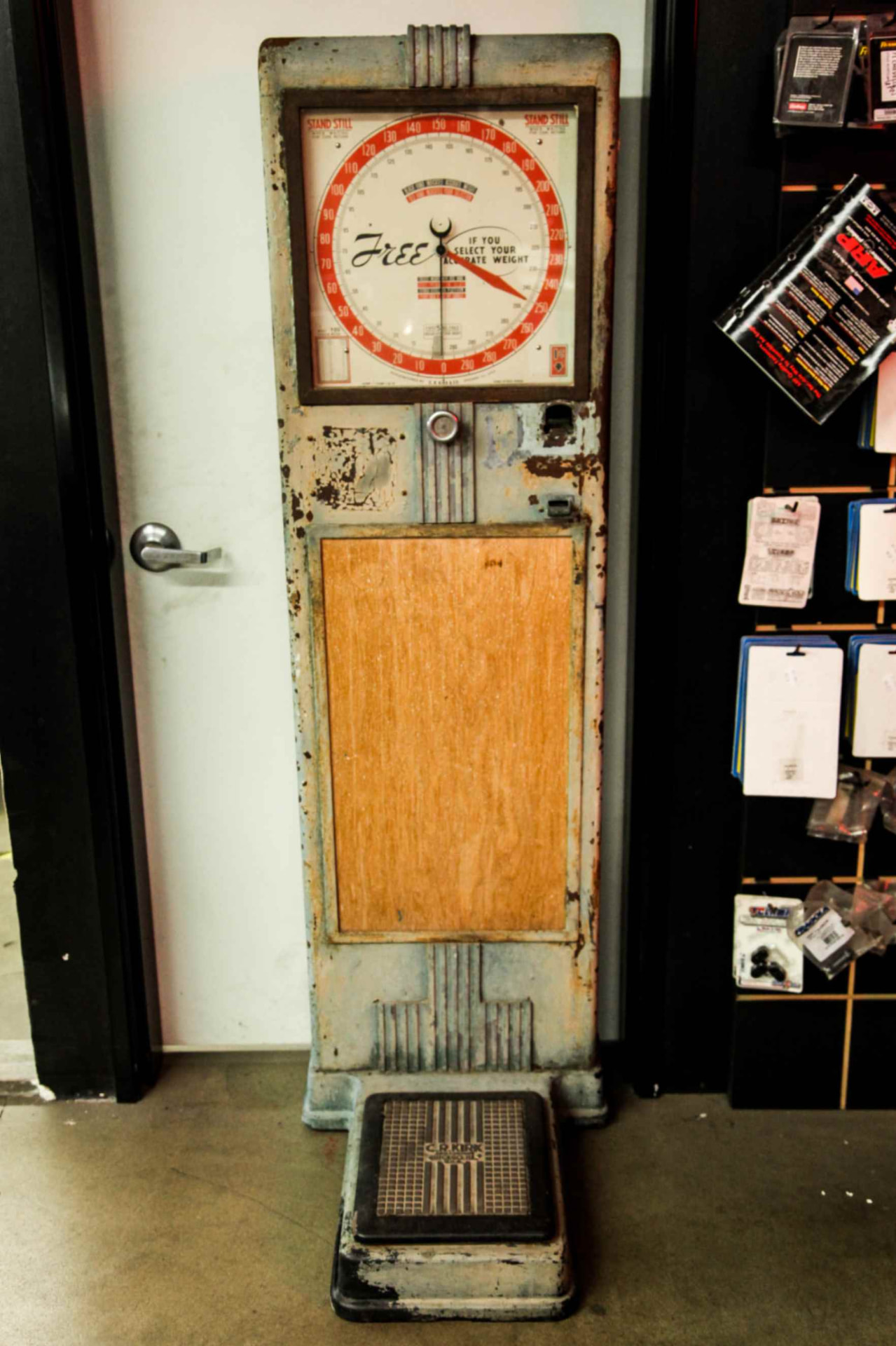 Scale in original condition: peeling paint and plywood panel insert