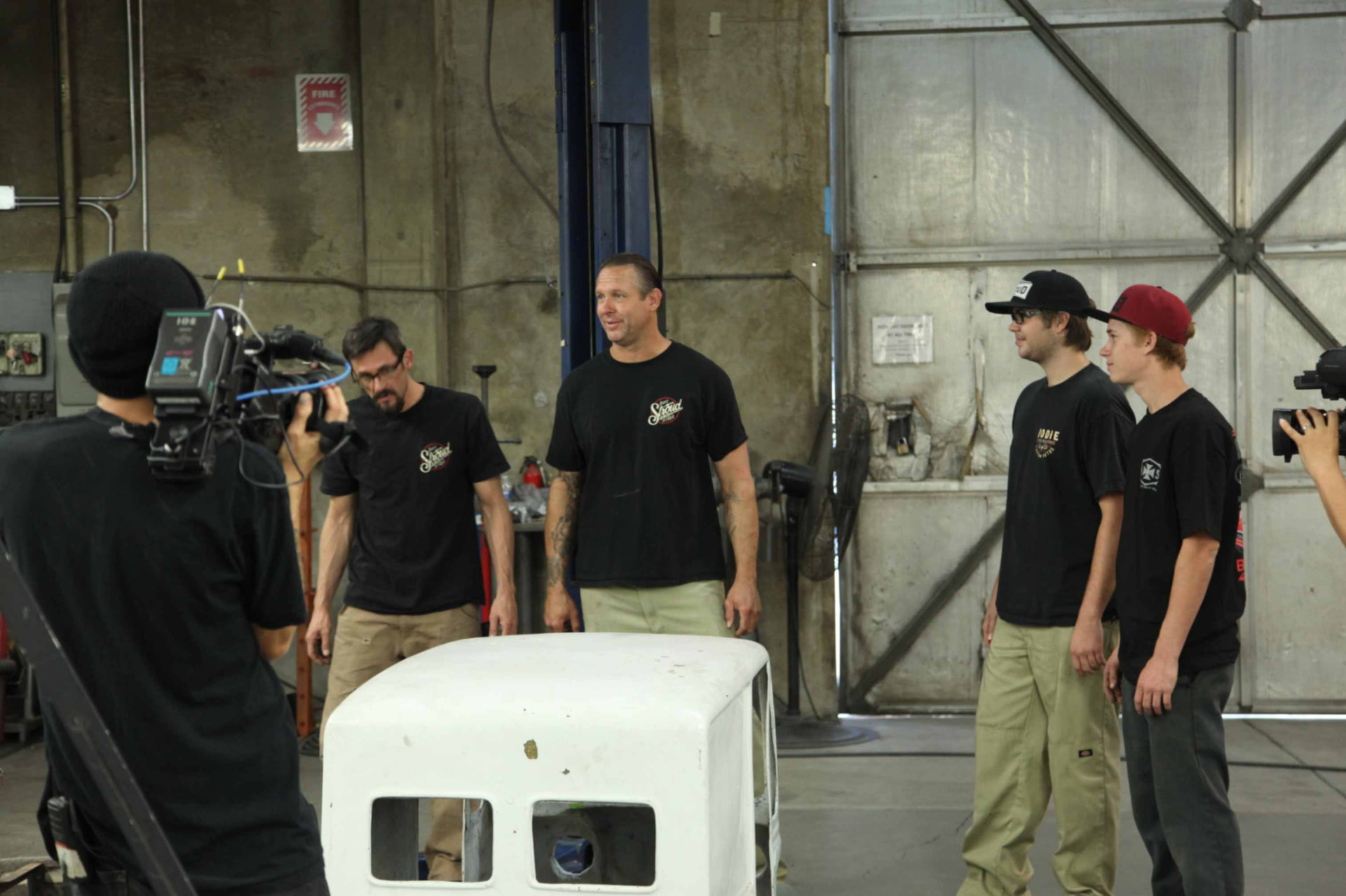 Bodie and the team with the original cab on camera in the shop