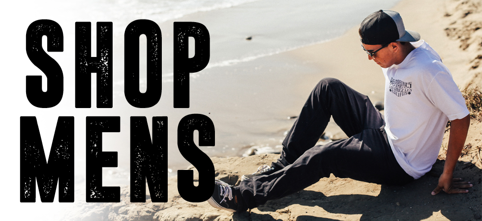 Man on the beach wearing a Bodie Stroud Industries tee