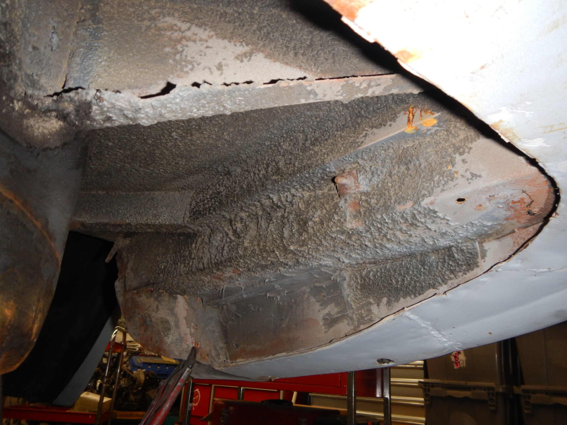 Corroded floor panel removed for repair