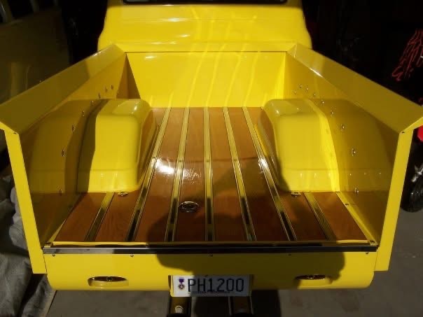 Finished yellow bed with polished wood floor