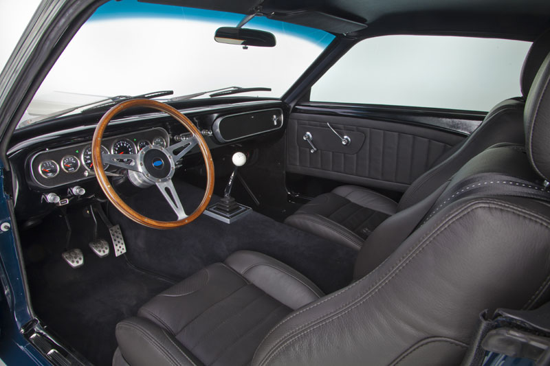 Custom leather interior with wood-rim wheel and six-speed