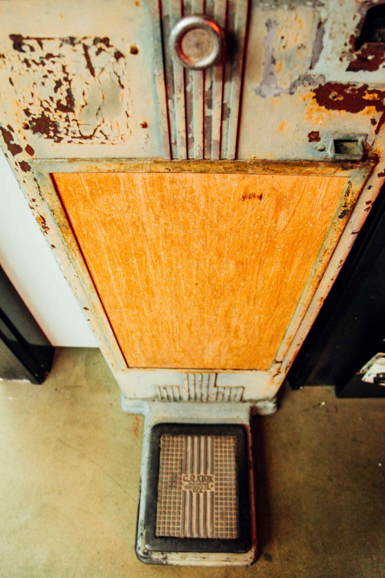 Original platform and coin slot before restoration