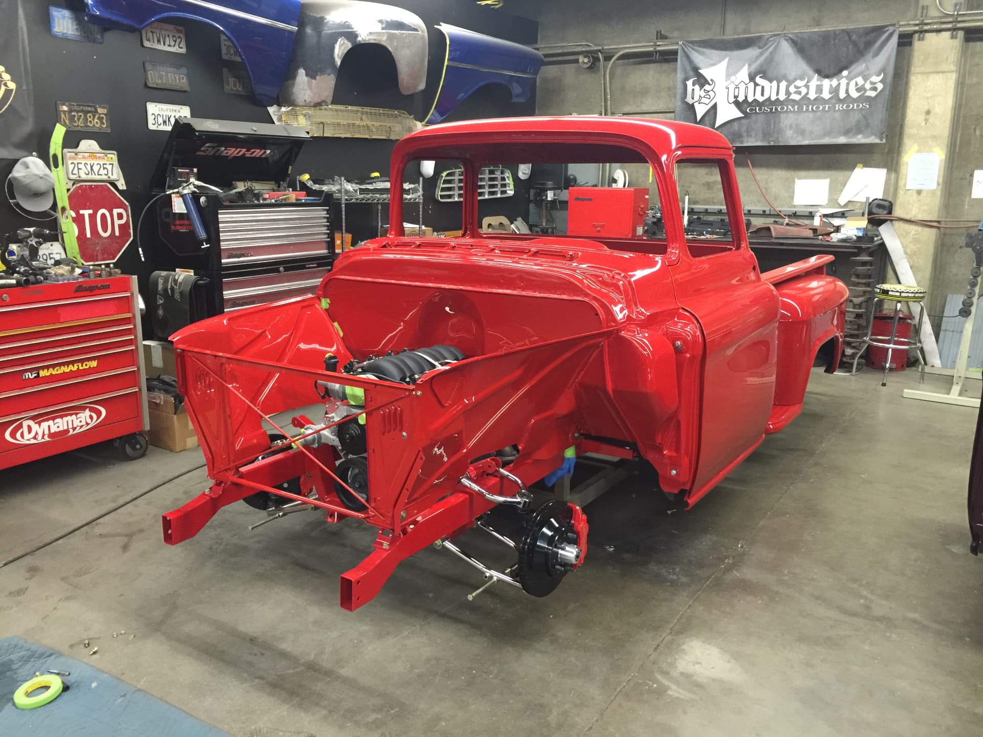 Fresh red bodywork on the chassis — rear view