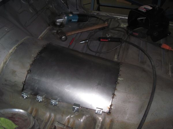 Hand-formed transmission tunnel panel fitted in the floor
