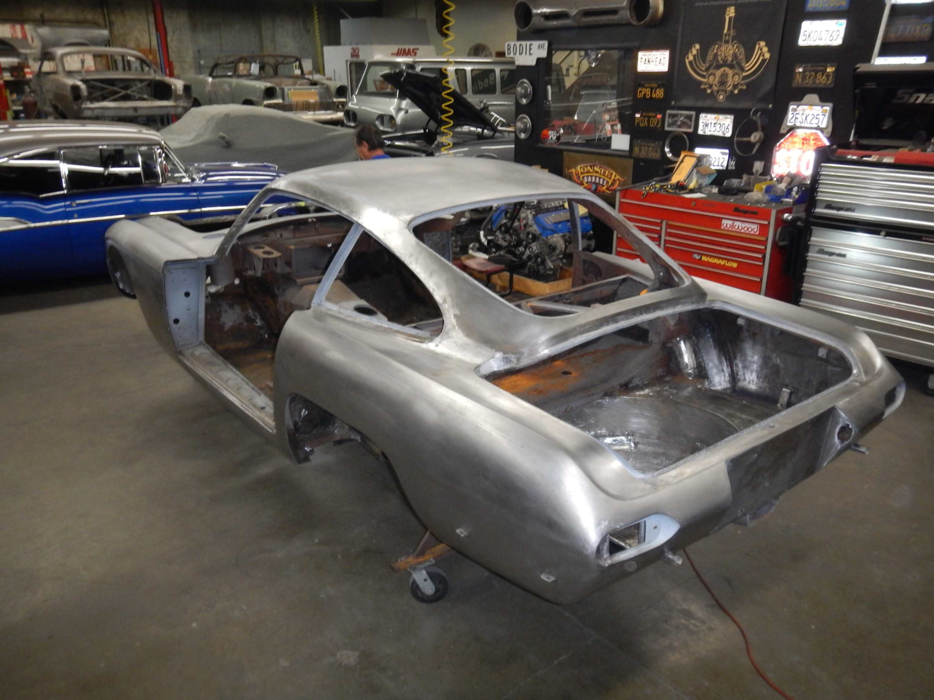 Bare aluminum body shell in the shop