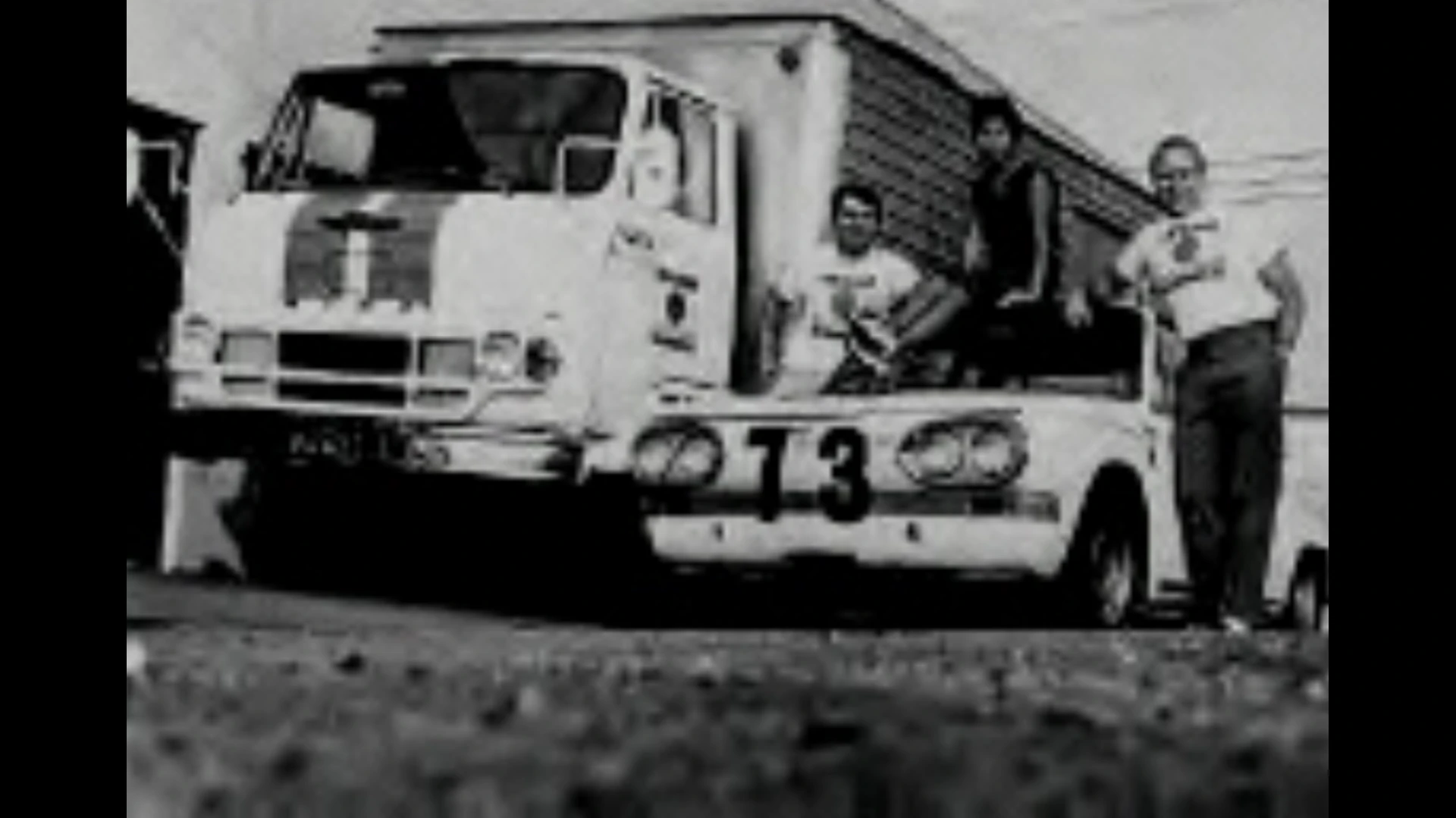 Historic BRE Hino Transporter with the number 73 race car