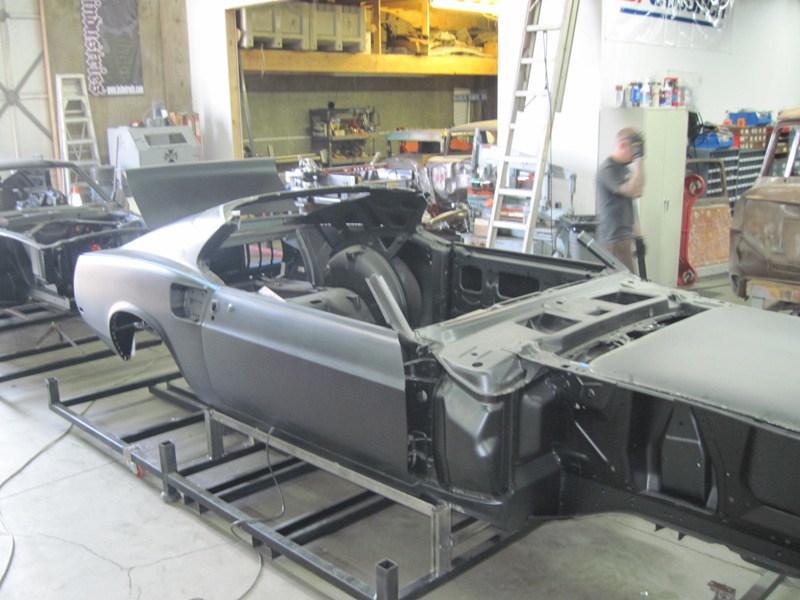 Body in primer on the jig during metalwork