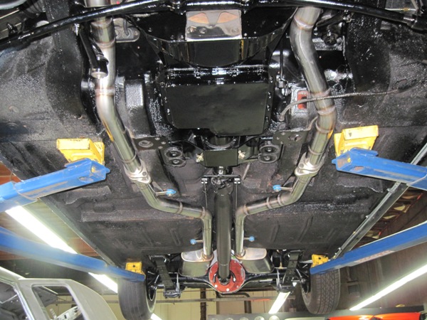 Underside on the lift — driveline, crossmember and exhaust finish work
