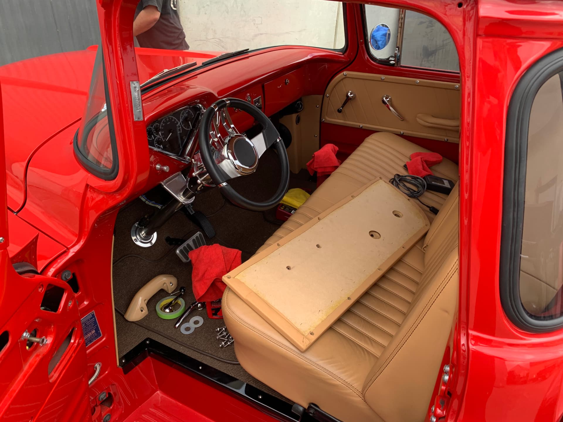 Interior trim install — saddle leather bench and custom dash
