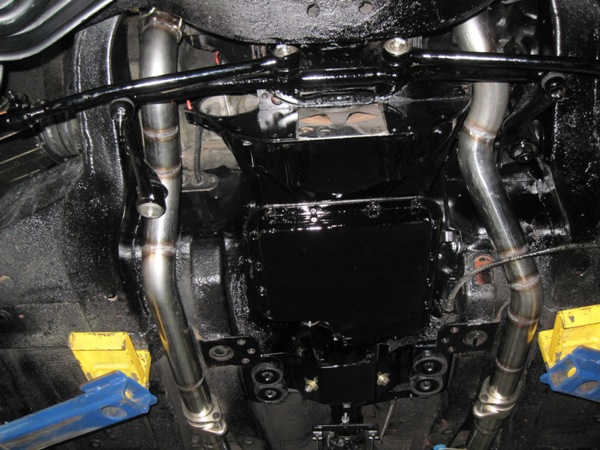 Custom stainless dual exhaust routed around the trans tunnel