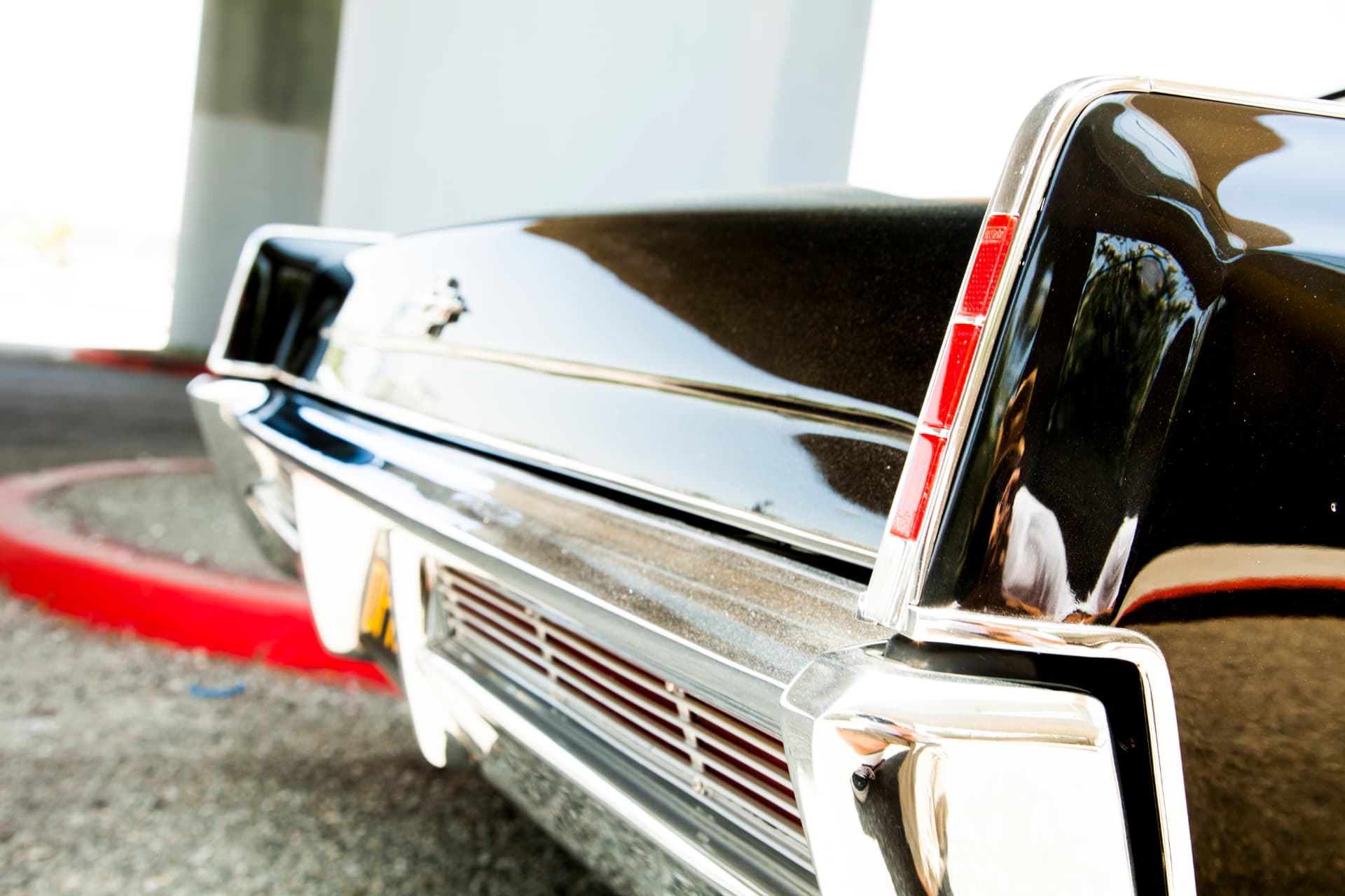 Rear quarter and taillight detail — factory chrome restored