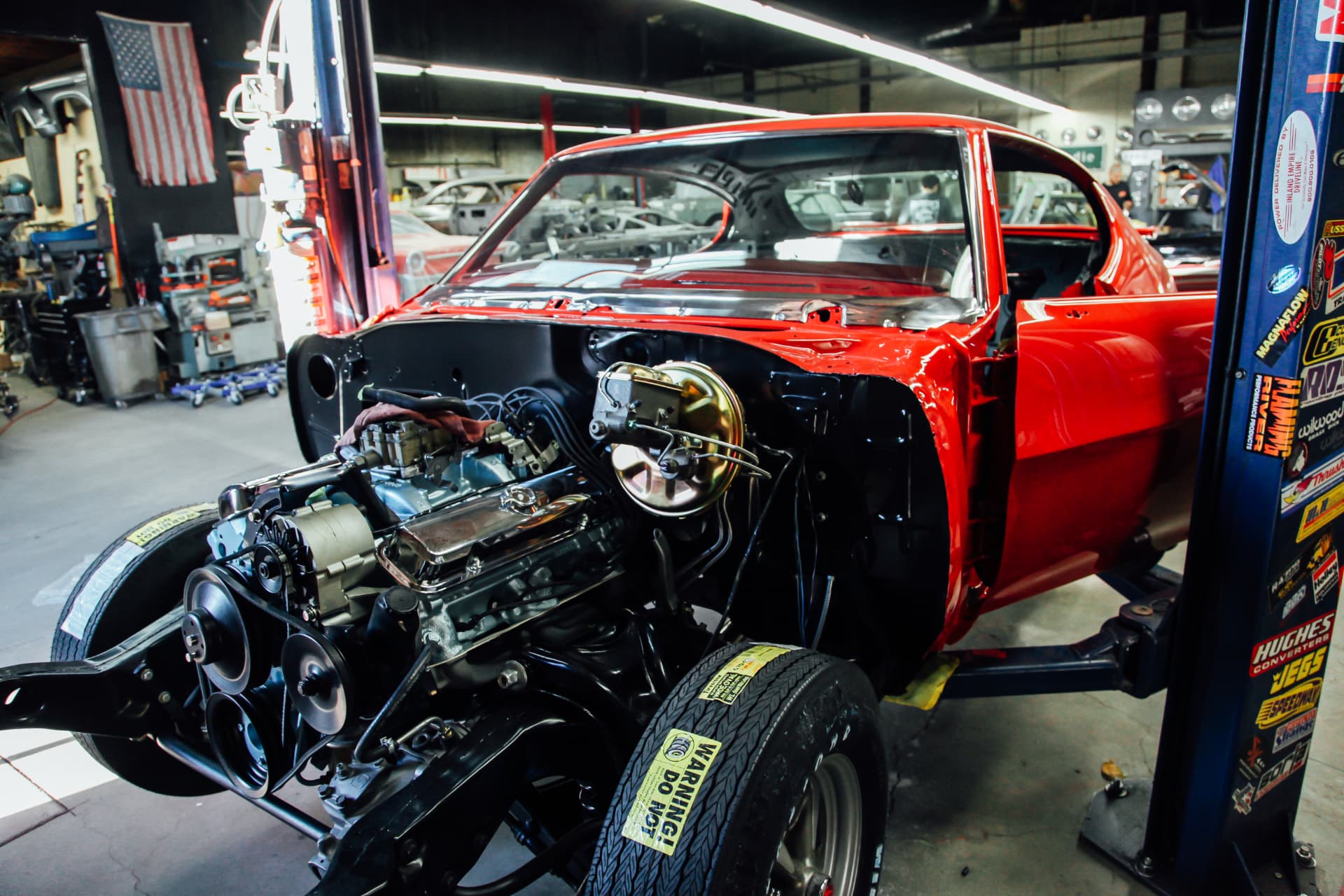 Fresh paint on the body, engine and front subframe going back in